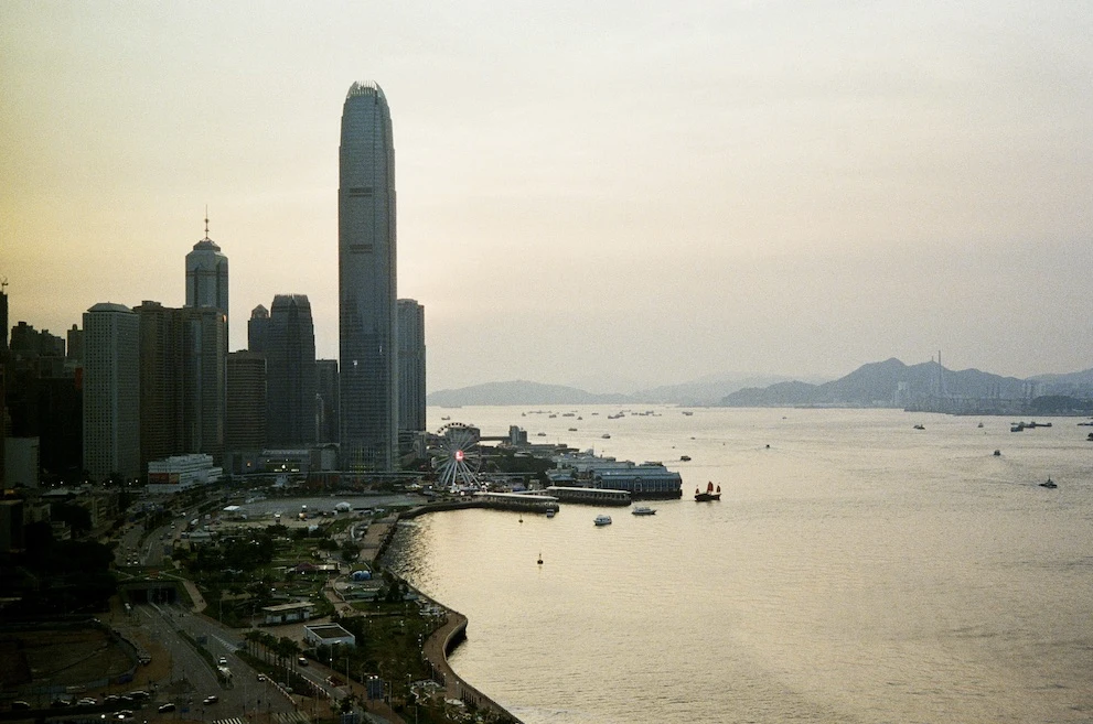 Victoria Harbour and the Central skyline at sunset, with Two IFC rising above the waterfront
