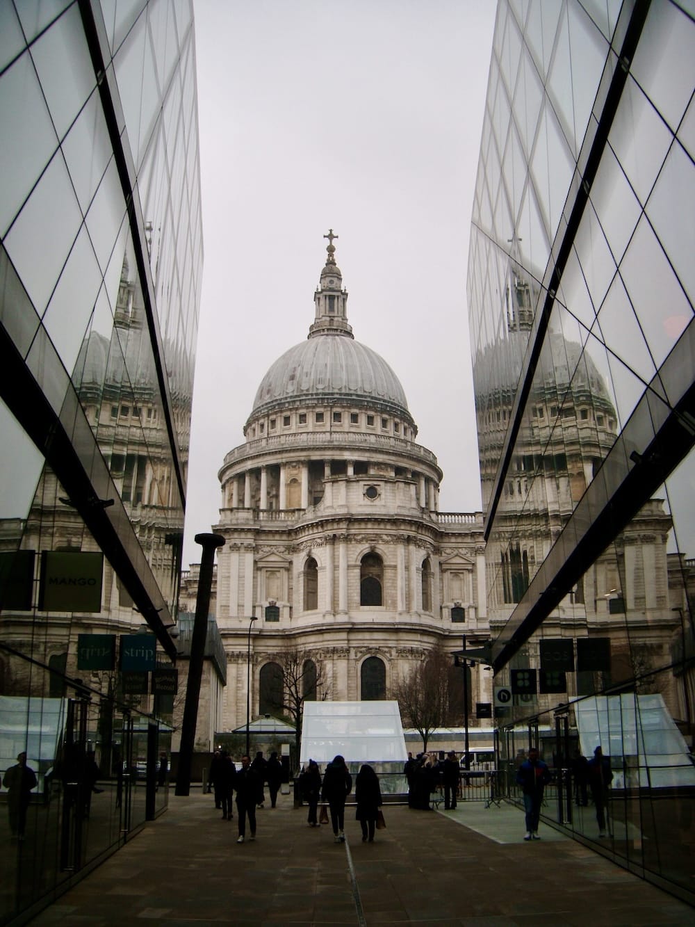 St Paul’s Cathedral framed and reflected by the angled glass walls of a passage at One New Change
